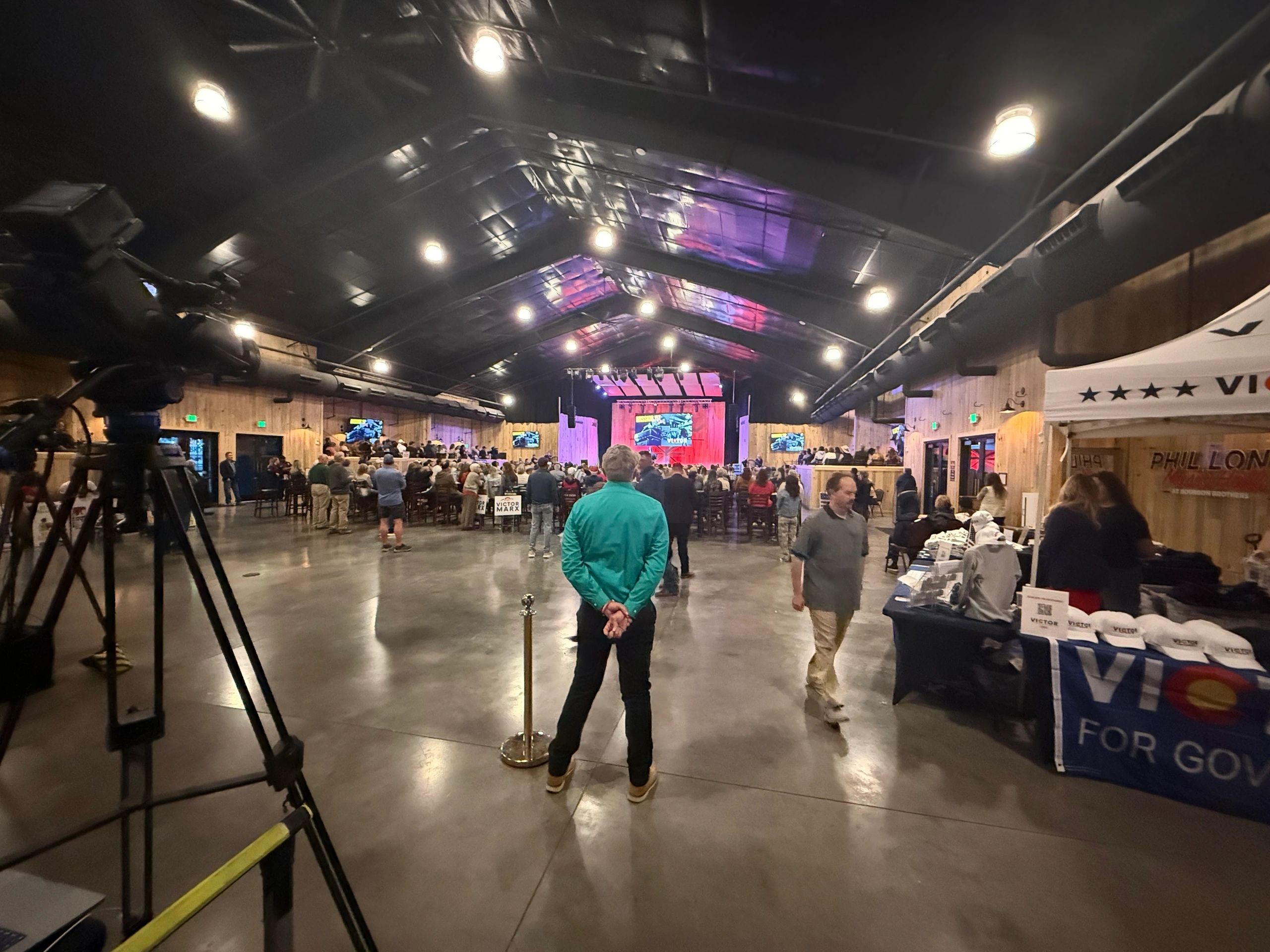 An audience and exhibition floor at a Victor Marx event